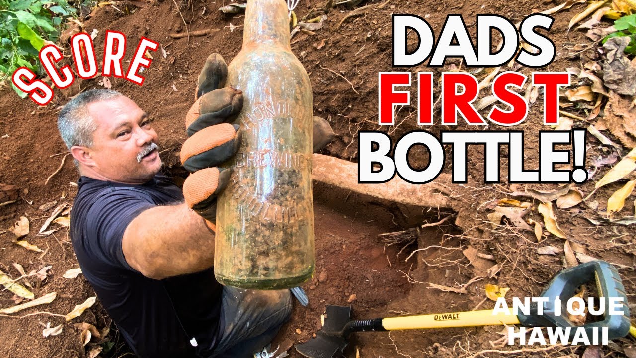 Collector discovering antique Hawaiian bottle during a bottle digging expedition in Oahu