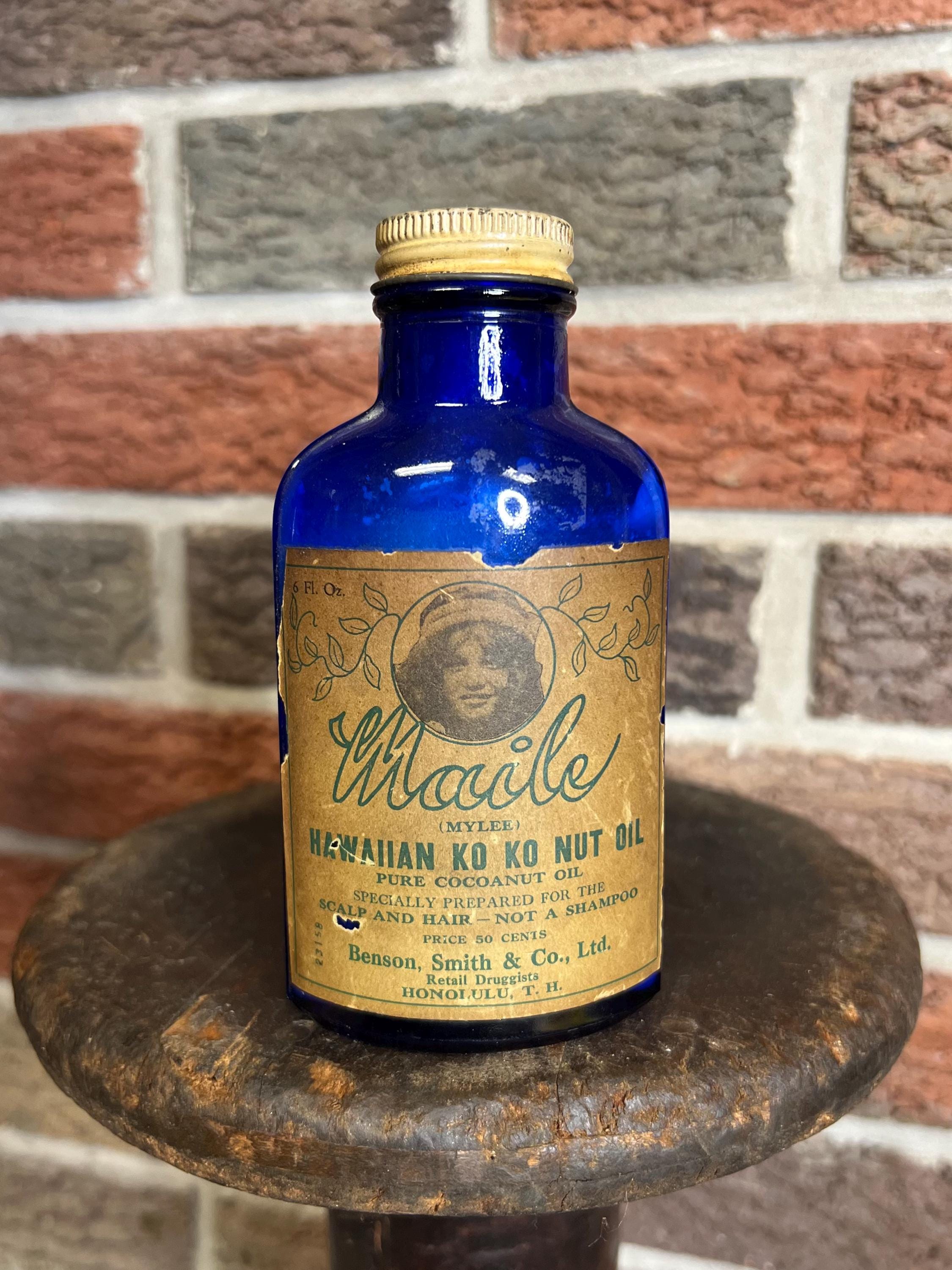 Rare antique Hawaiian cobalt blue glass bottle with original paper label from Honolulu